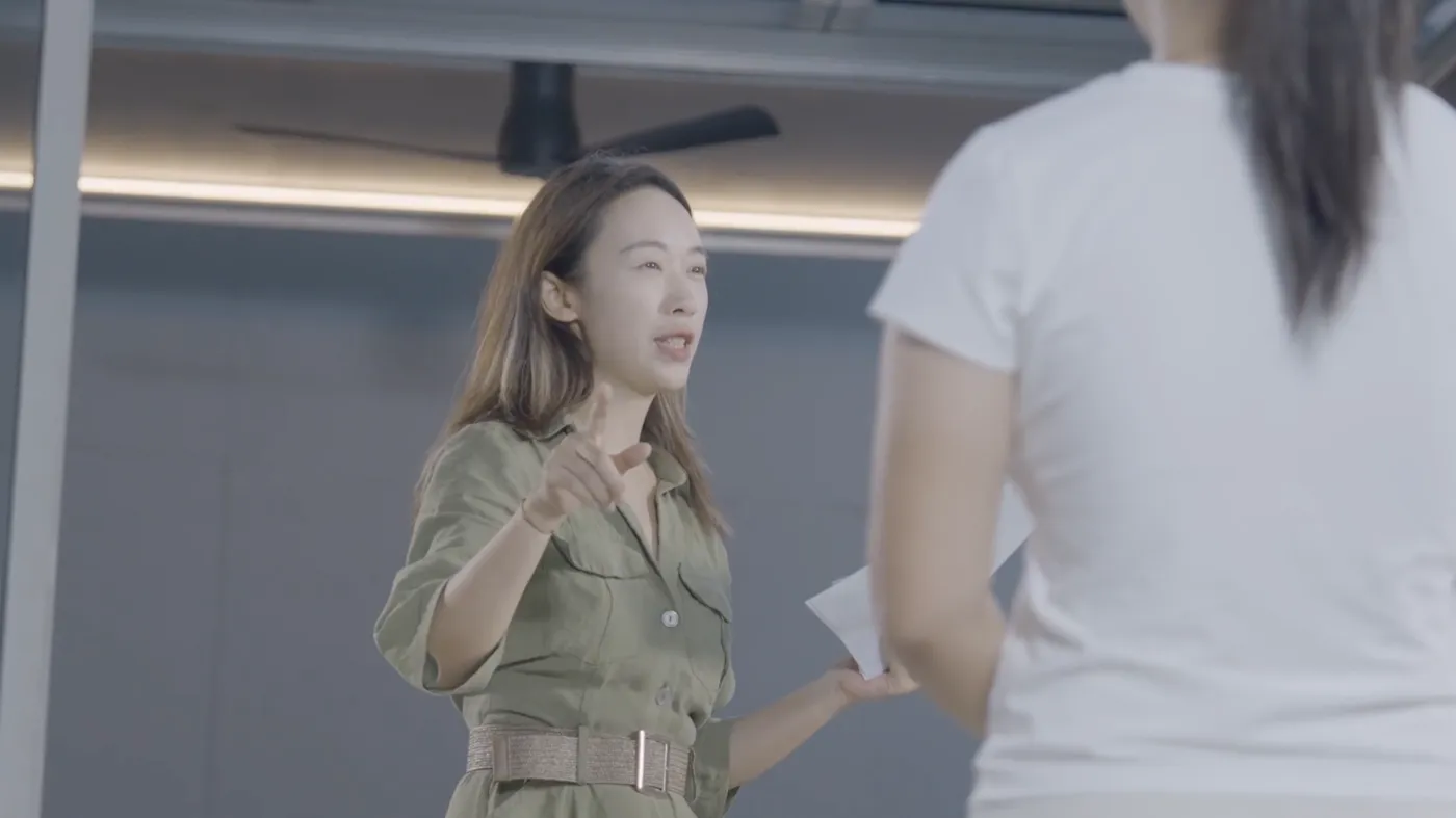 A member of the Outer Spaces team presenting to a colleague